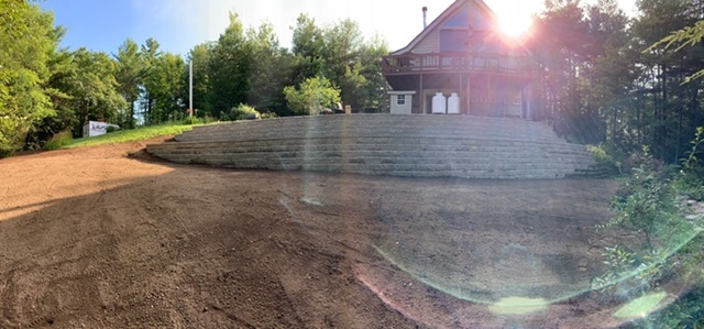 Retaining wall Cabin at top of hill Elf's Landscaping